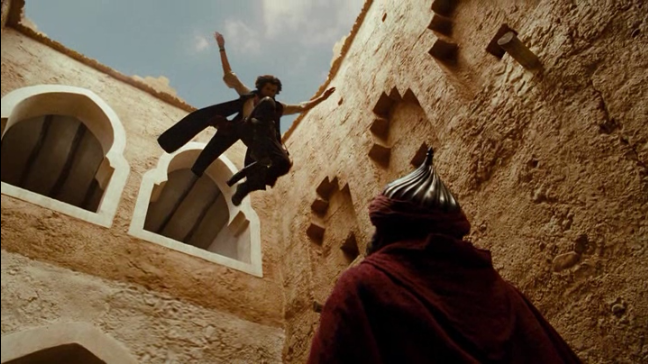 The Prince of Persia jumps from a window onto a guard.